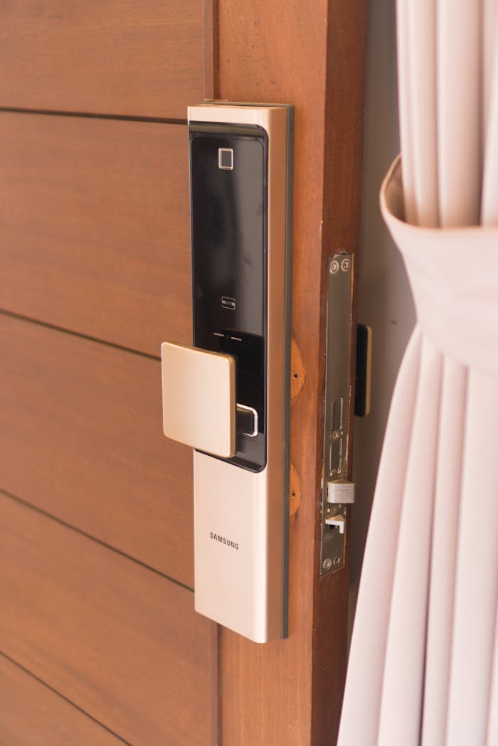 services-03 Close-up of a smart door lock system, offering enhanced security on a wooden door.